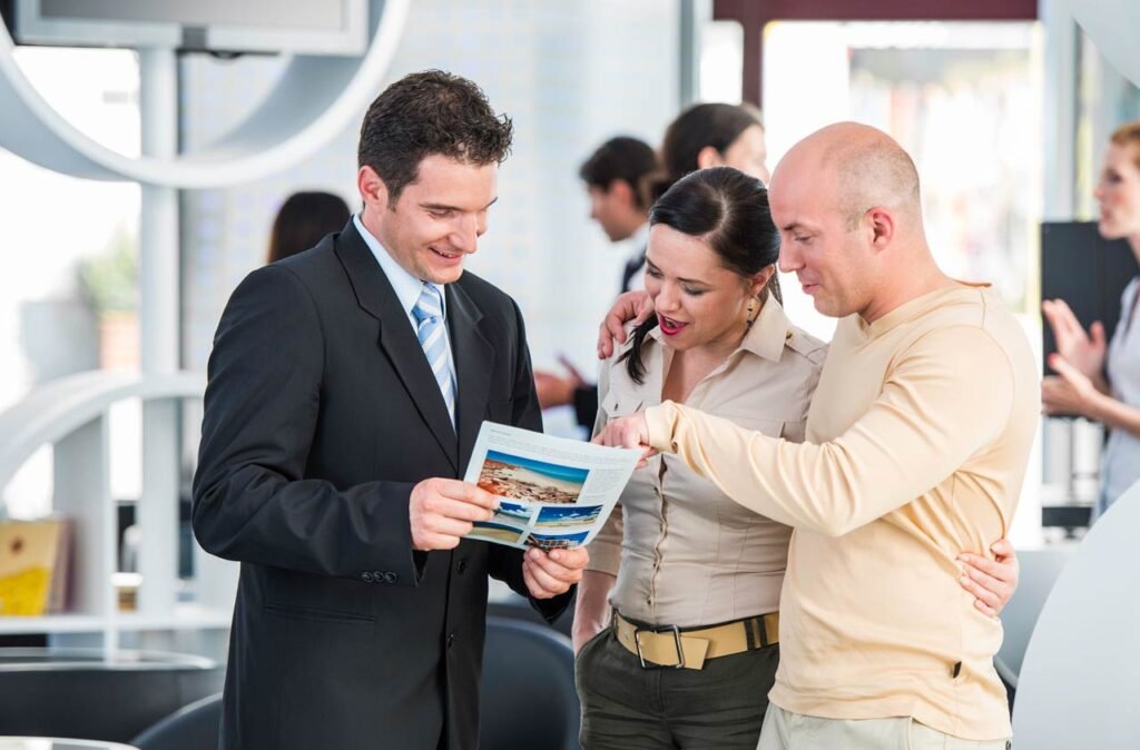 travel agent speaking with tourists